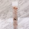 tall square clear tube with pink salt inside