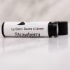 strawberry lip balm black tube with lid off