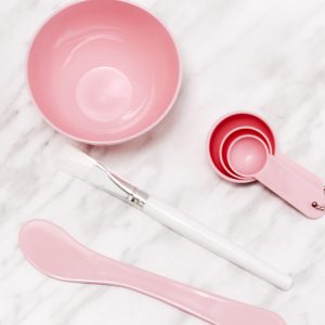 pink face mask bowl set. small bowl 3 measuring spoons white brush and spatula