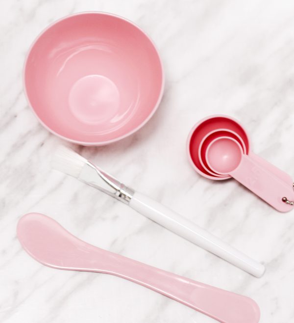 pink face mask bowl set. small bowl 3 measuring spoons white brush and spatula