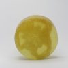 Lime colour round soap with a loofah inside approx. 1 inch thick and 3 inches across scented in Margarita